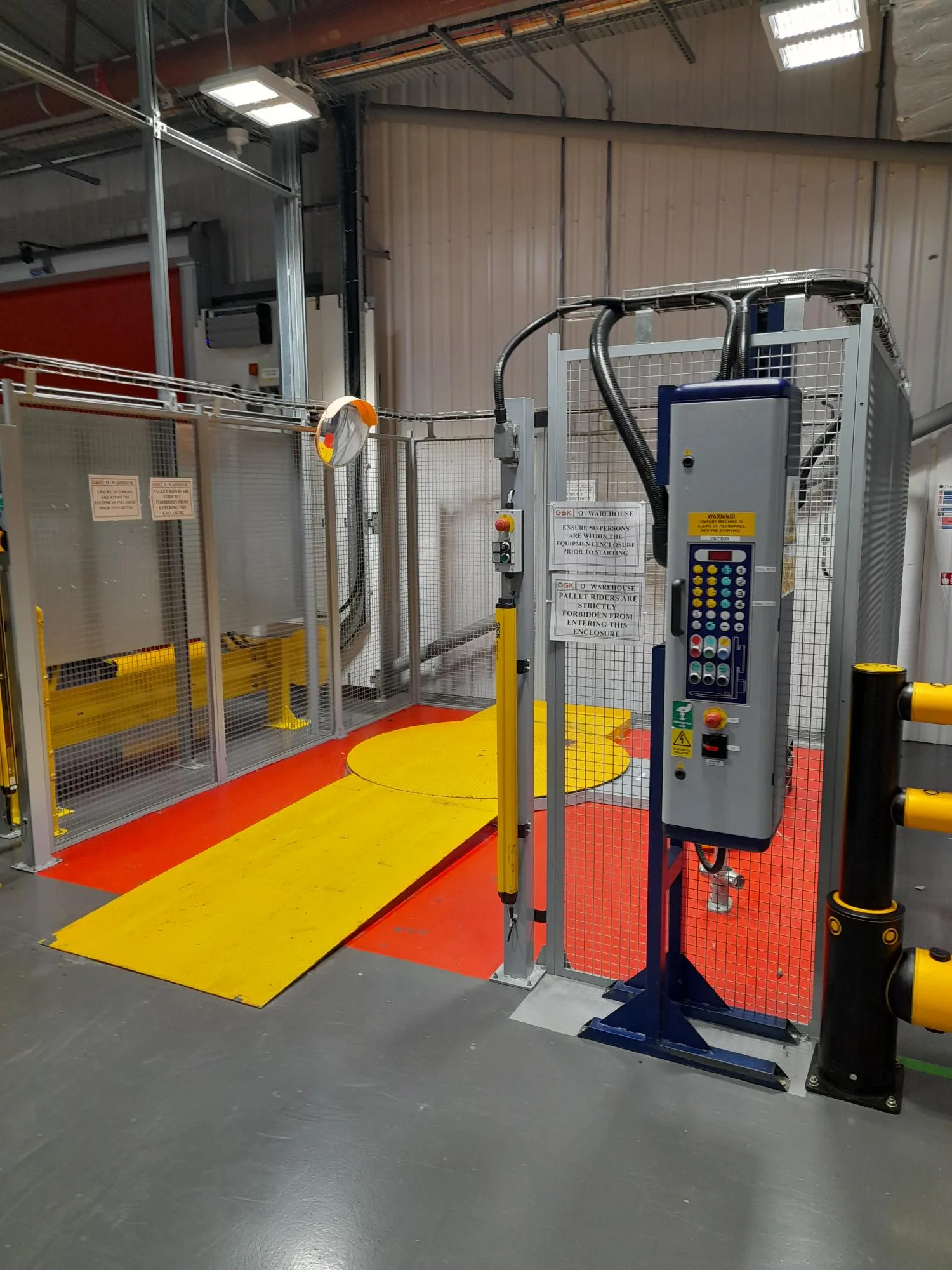 External control panel and safety guarding on Robopac Rotoplat 507 pallet wrapping area